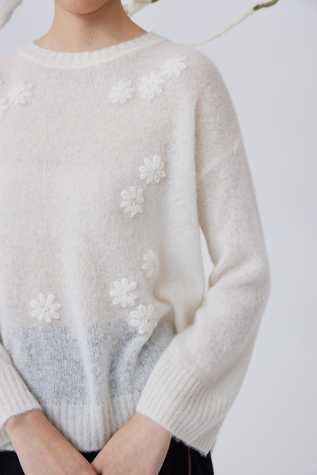 Women's flower embellished top